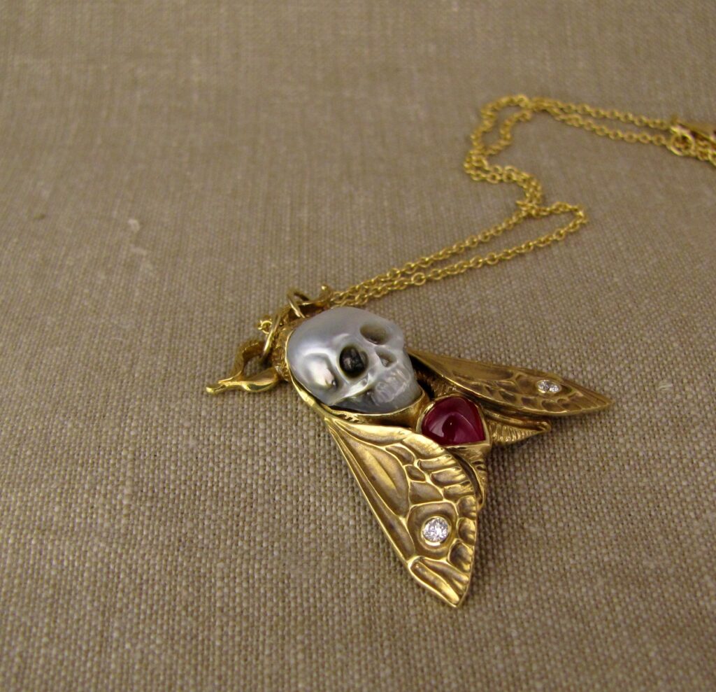 Hand-carved Death's Head Hawkmoth Memento Mori pendant, carved pearl skull, ruby, diamonds, 18K, cheyenne weil jewelry