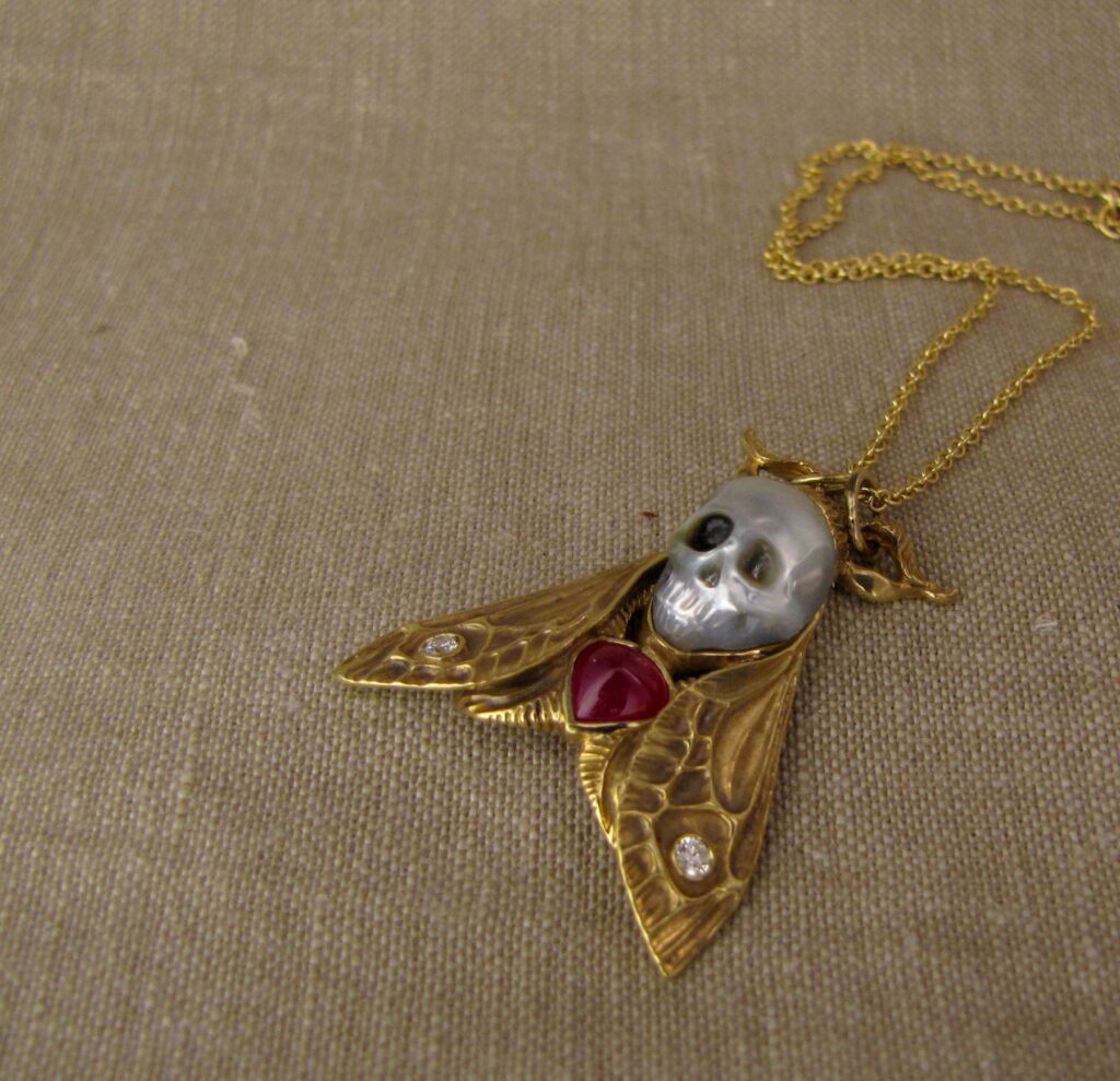 Hand-carved Death's Head Hawkmoth Memento Mori pendant, carved pearl skull, ruby, diamonds, 18K, cheyenne weil jewelry