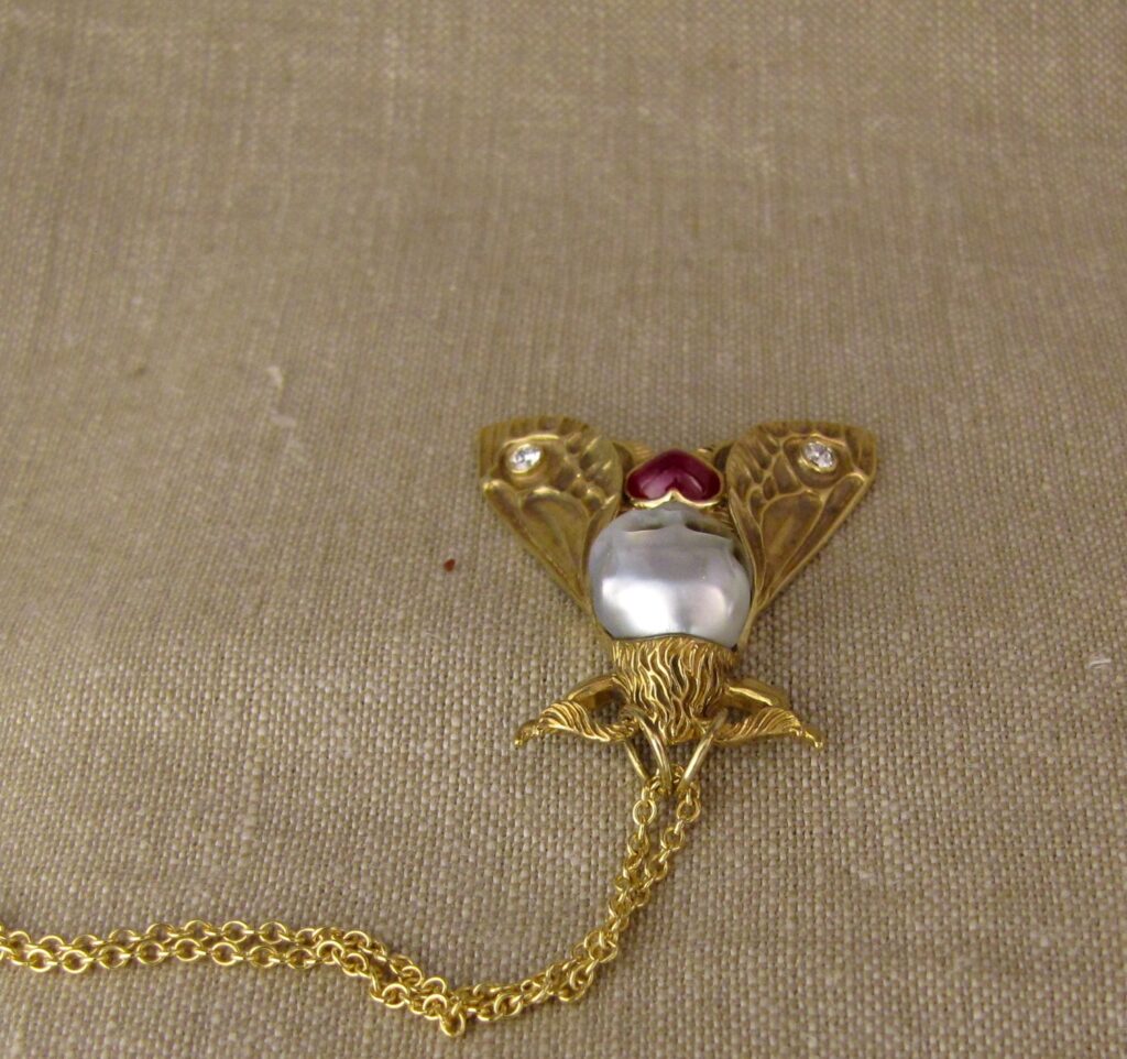 Hand-carved Death's Head Hawkmoth Memento Mori pendant, carved pearl skull, ruby, diamonds, 18K, cheyenne weil jewelry