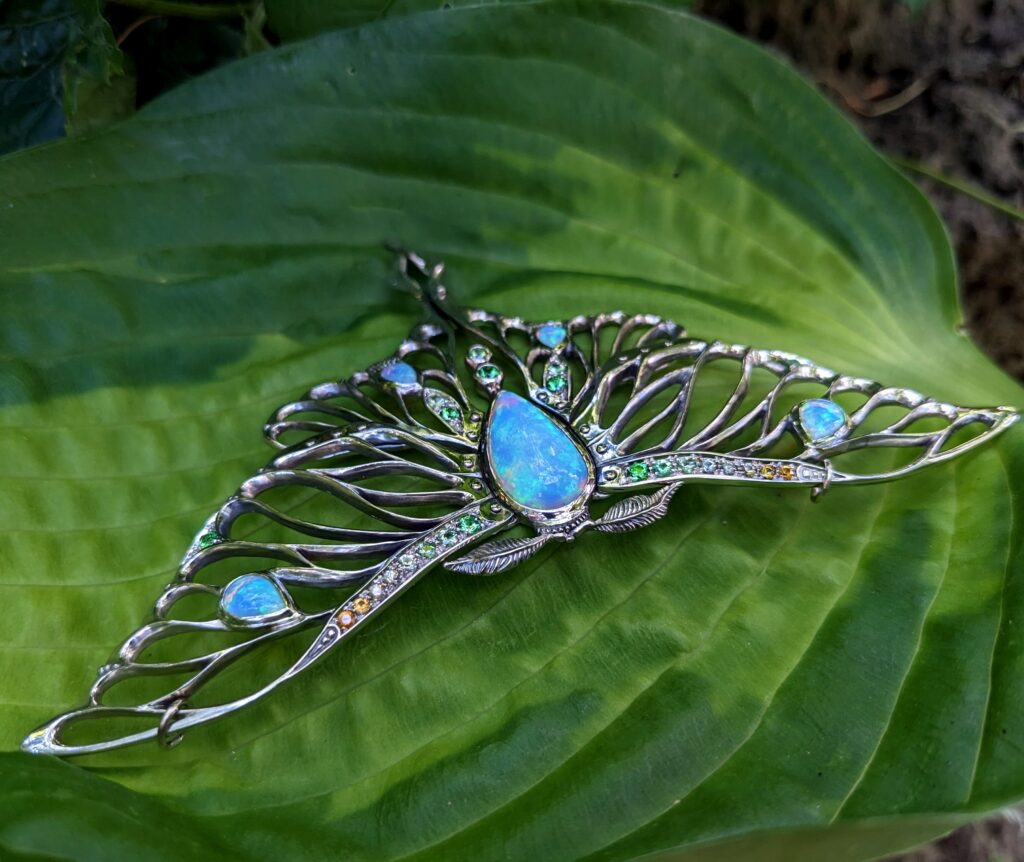 Luna Moth pendant/neckpiece with opals, sapphires, and tsavorite garnets, 14K white gold. cheyenne weil jewelry