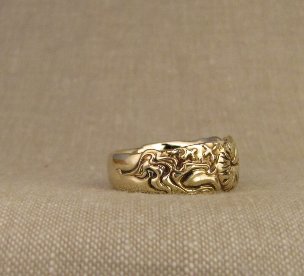 Nautilus & magnetic domains carved ring, emerald & 14K gold, cheyenne weil jewelry