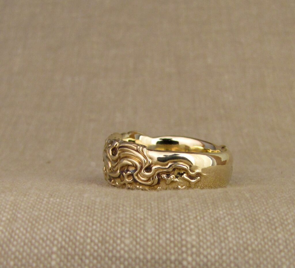 Nautilus & magnetic domains carved ring, emerald & 14K gold, cheyenne weil jewelry