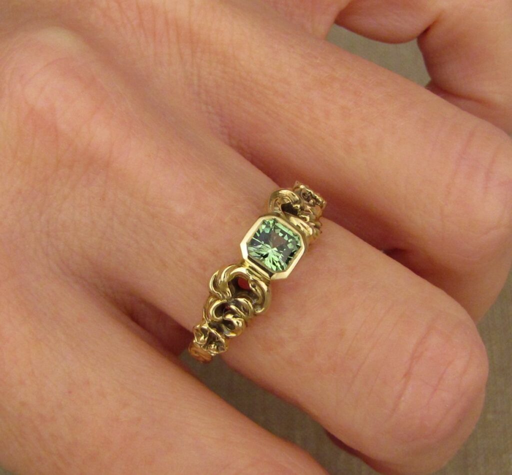 Custom Ocean waves with shells solitaire, set with seafoam-green garnet, 18K yellow gold, cheyenne weil jewelry