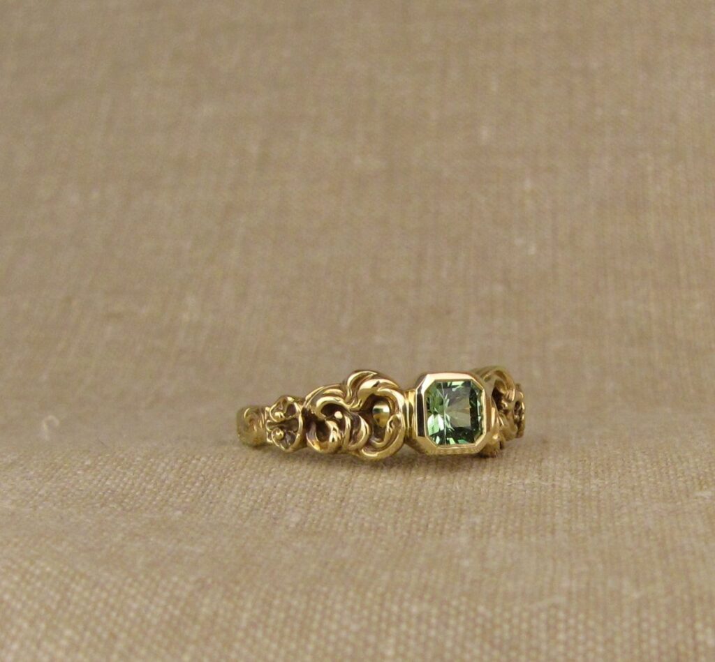 Custom Ocean waves with shells solitaire, set with seafoam-green garnet, 18K yellow gold, cheyenne weil jewelry