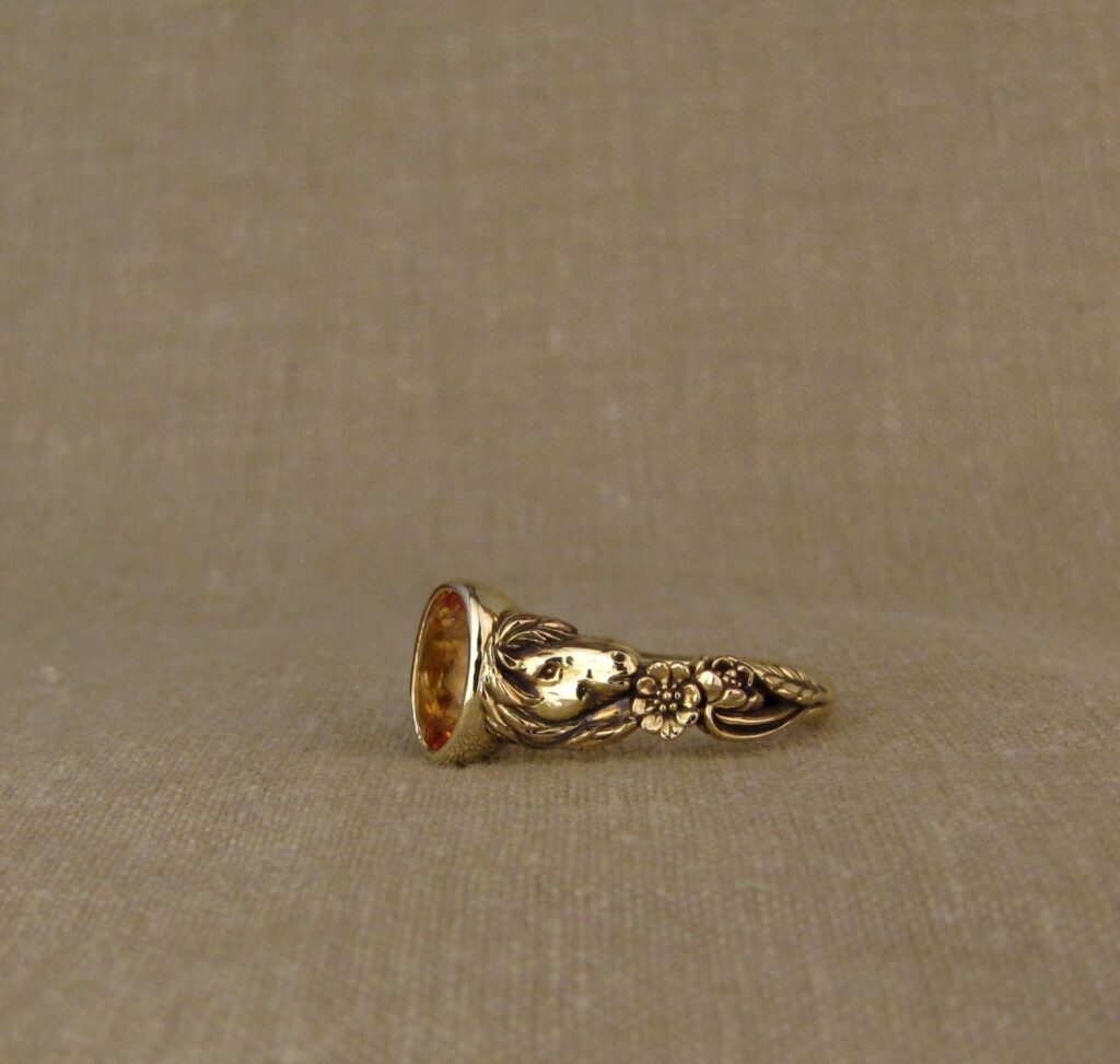 Custom carved Icelandic horses solitaire with Imperial topaz, 14K yellow gold, Cheyenne Weil