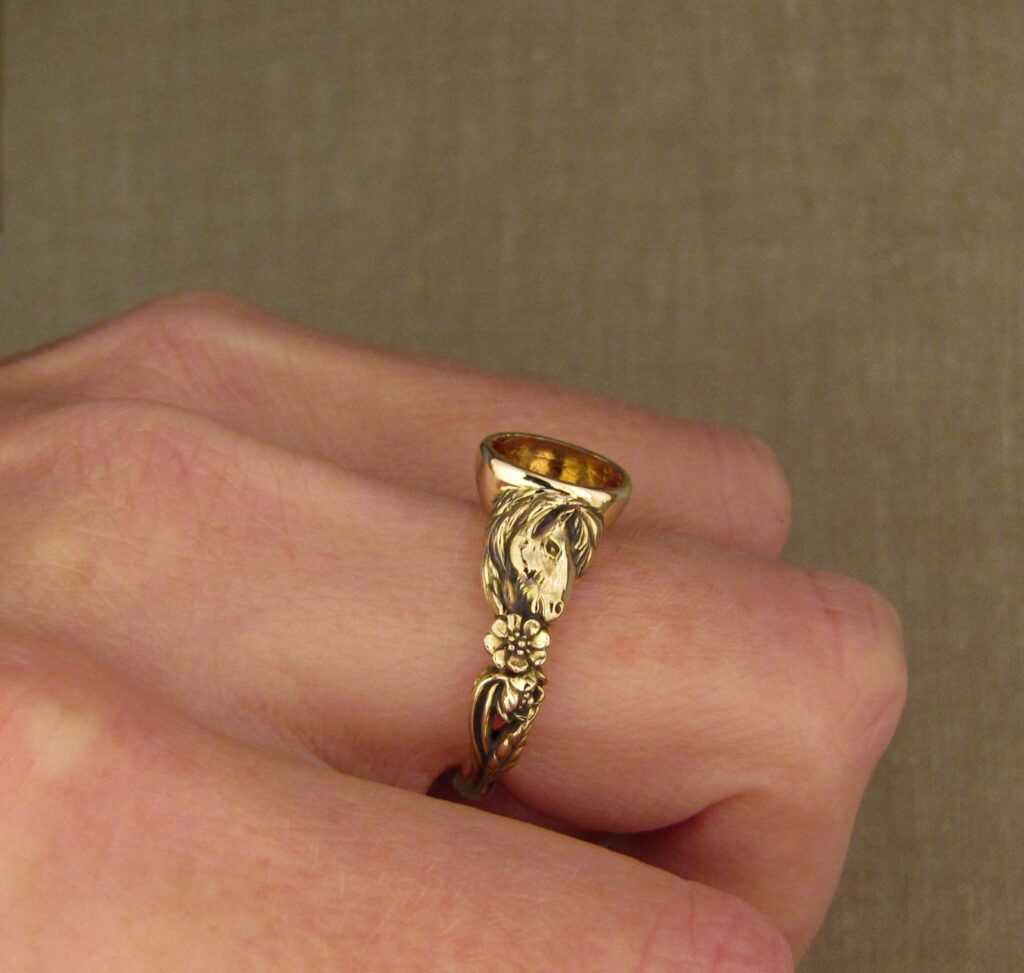 Custom carved Icelandic horses solitaire with Imperial topaz, 14K yellow gold, Cheyenne Weil