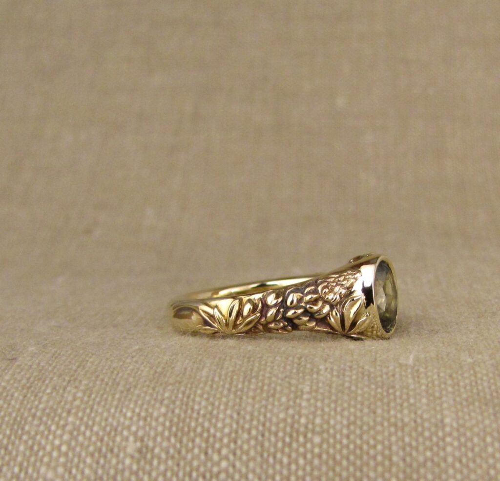 Custom carved Lupine Solitaire, Green Sapphire and 14K gold, Cheyenne Weil