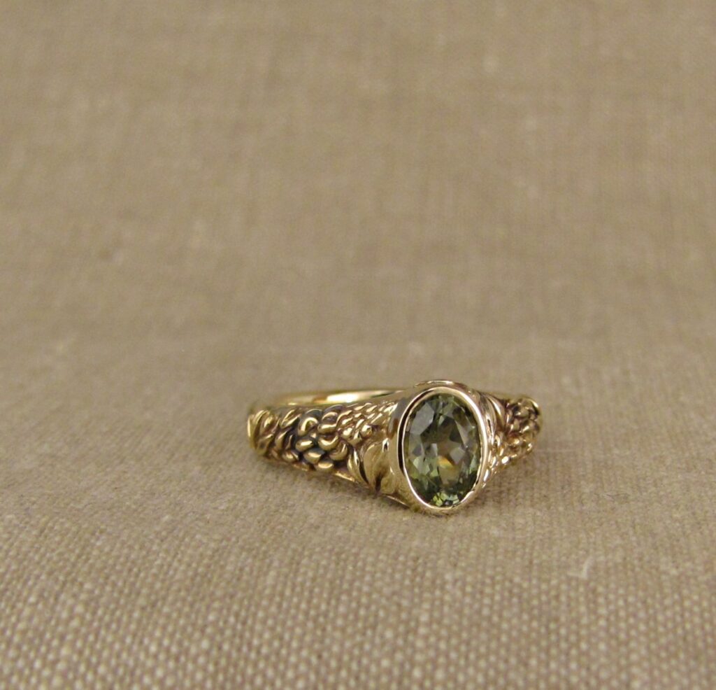 Custom carved Lupine Solitaire, Green Sapphire and 14K gold, Cheyenne Weil