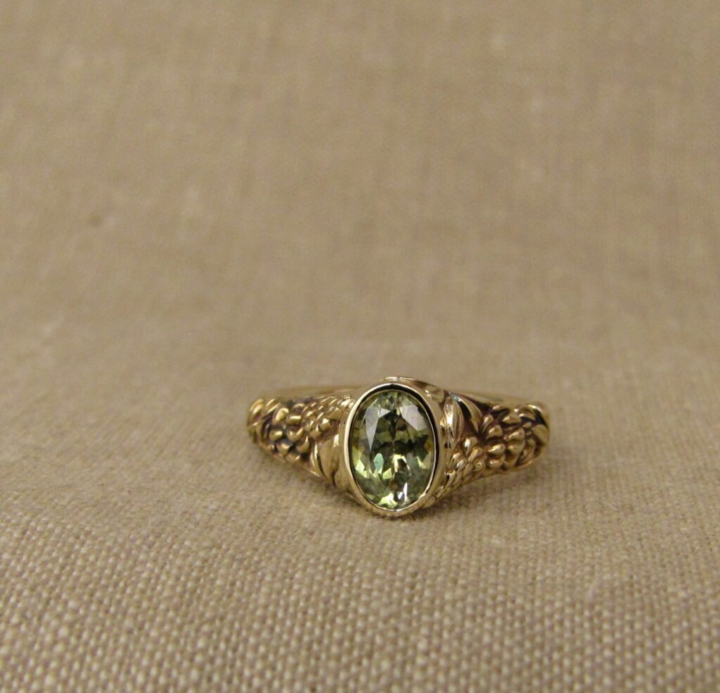 Custom carved Lupine Solitaire, Green Sapphire and 14K gold, Cheyenne Weil