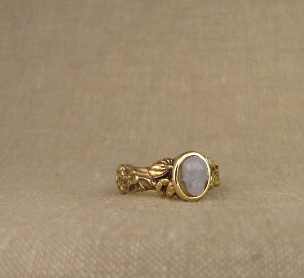 Memento Mori ring set with carved agate skull, bones, botanicals, bugs, 18K yellow gold. Cheyenne Weil
