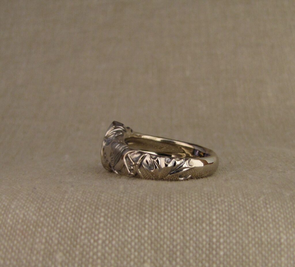 Custom carved Sapphire Solitaire with Quail and Cardinal motifs. Palladium white gold, Blue sapphire, Cheyenne Weil