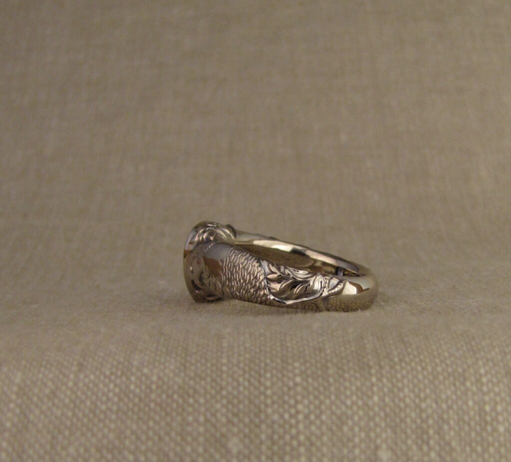 Custom carved Sapphire Solitaire with Quail and Cardinal motifs. Palladium white gold, Blue sapphire, Cheyenne Weil