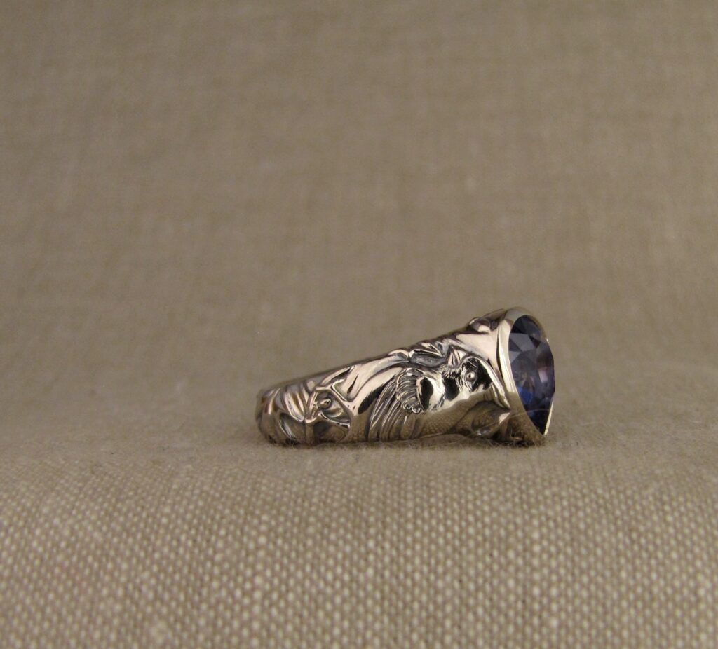 Custom carved Sapphire Solitaire with Quail and Cardinal motifs. Palladium white gold, Blue sapphire, Cheyenne Weil