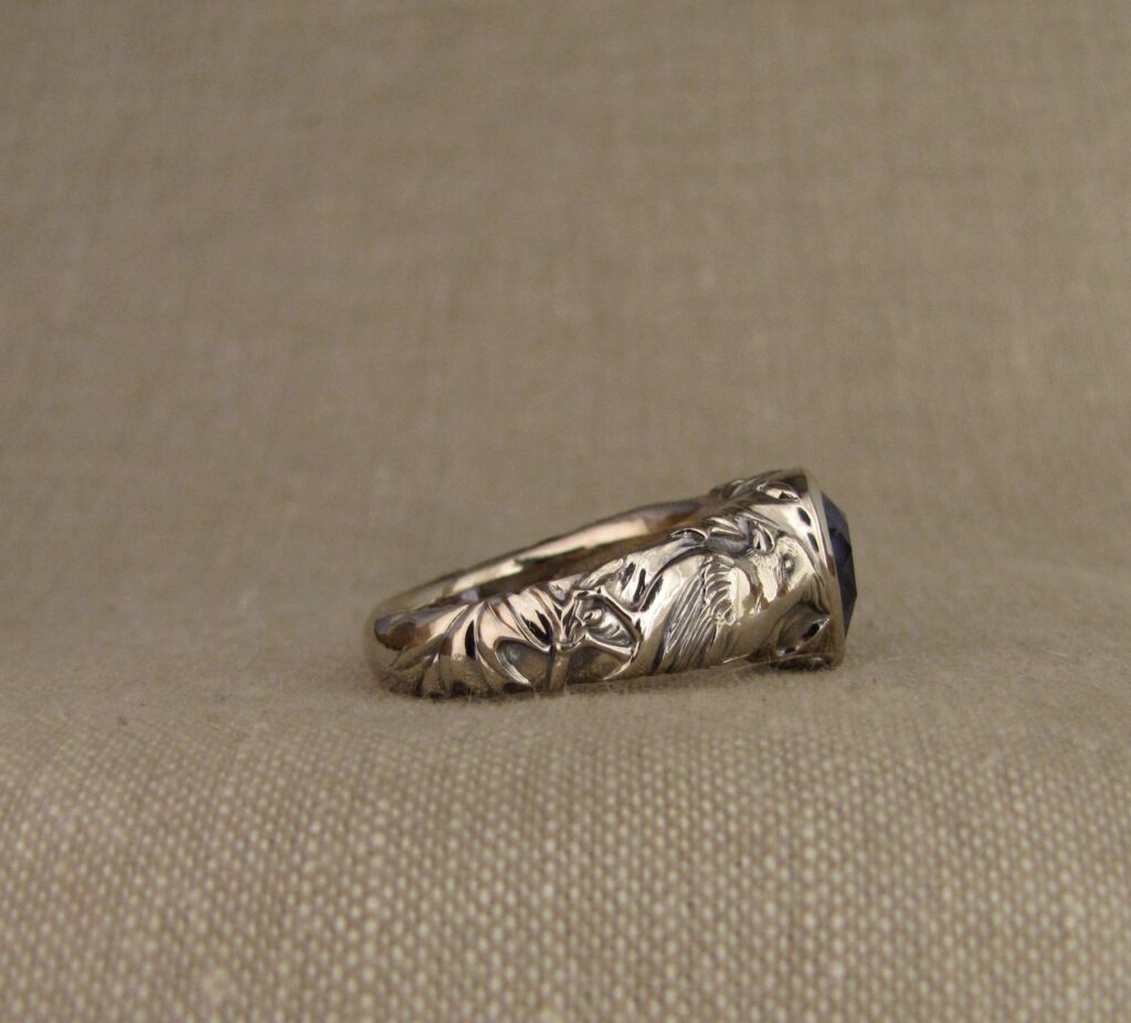 Custom carved Sapphire Solitaire with Quail and Cardinal motifs. Palladium white gold, Blue sapphire, Cheyenne Weil
