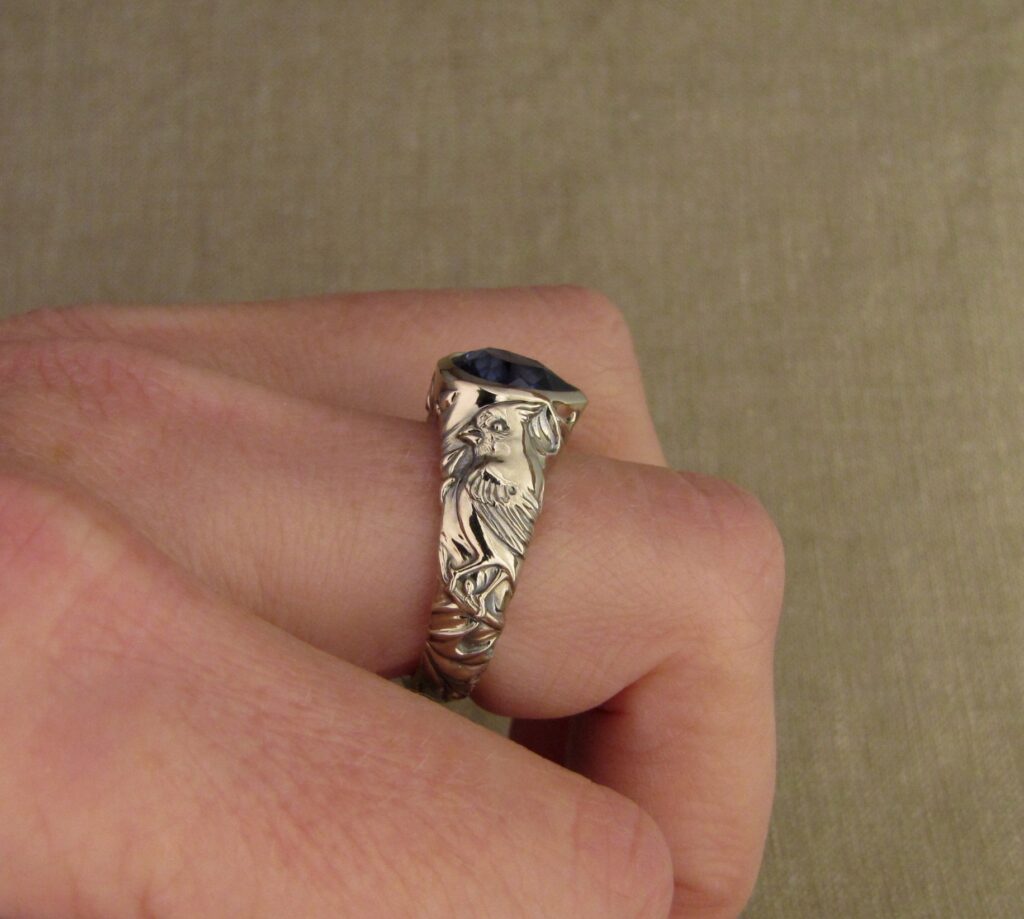 Custom carved Sapphire Solitaire with Quail and Cardinal motifs. Palladium white gold, Blue sapphire, Cheyenne Weil