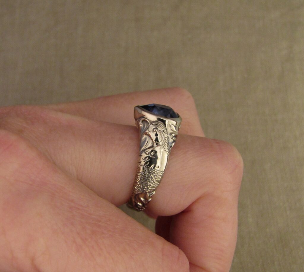 Custom carved Sapphire Solitaire with Quail and Cardinal motifs. Palladium white gold, Blue sapphire, Cheyenne Weil
