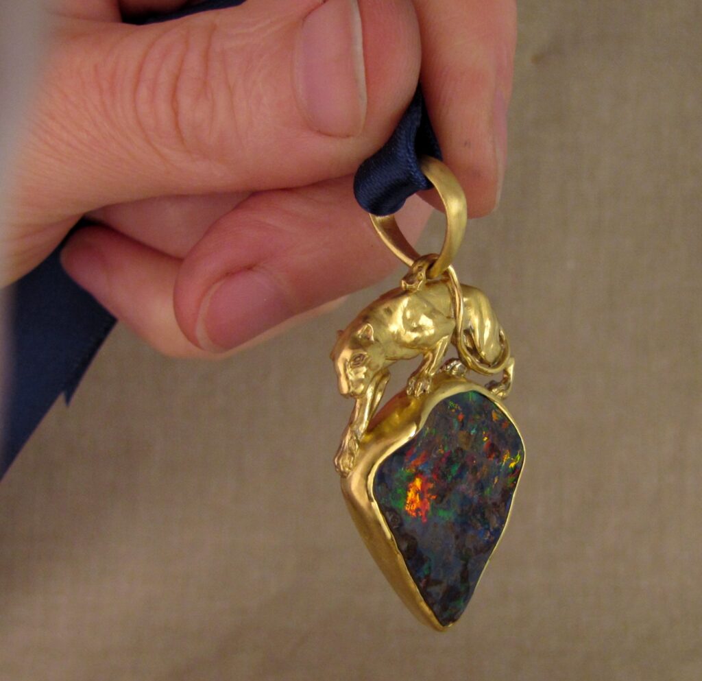 Custom carved Lioness Pendant in 22K, Rainbow Boulder Opal. Cheyenne Weil