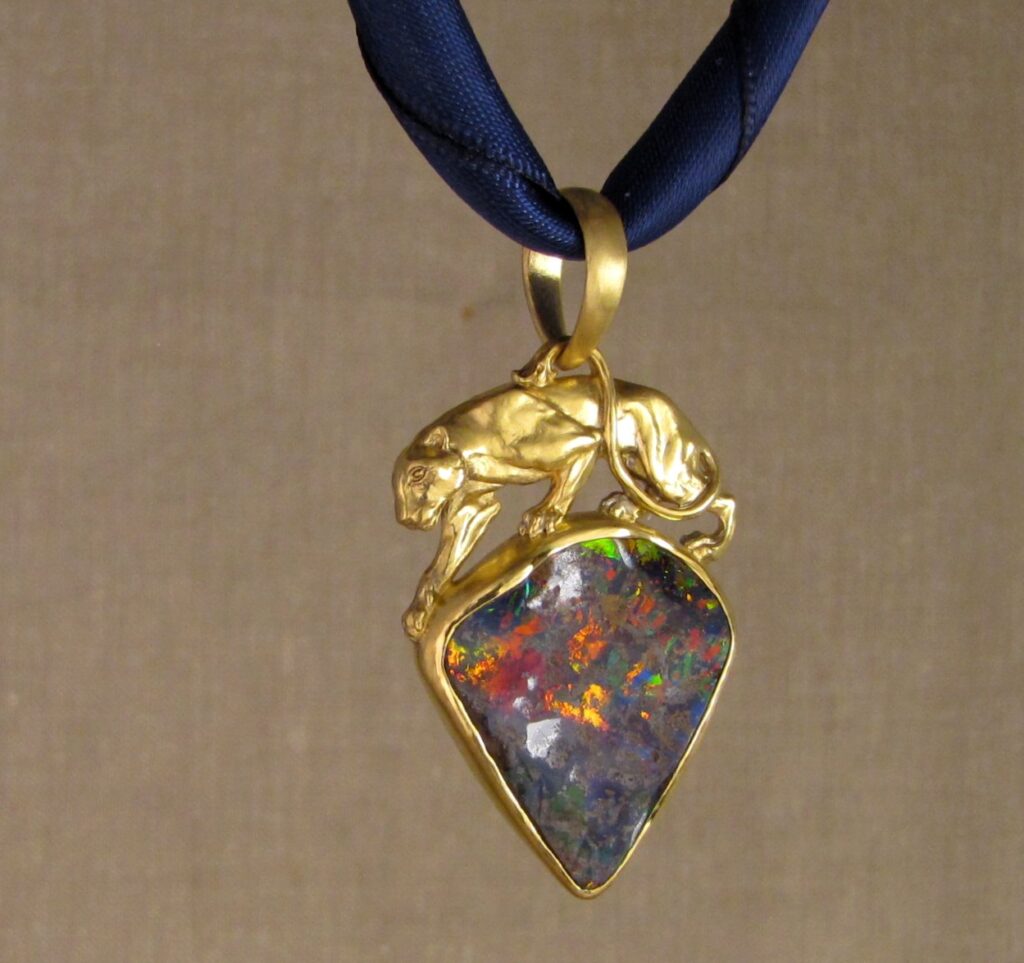 Custom carved Lioness Pendant in 22K, Rainbow Boulder Opal. Cheyenne Weil