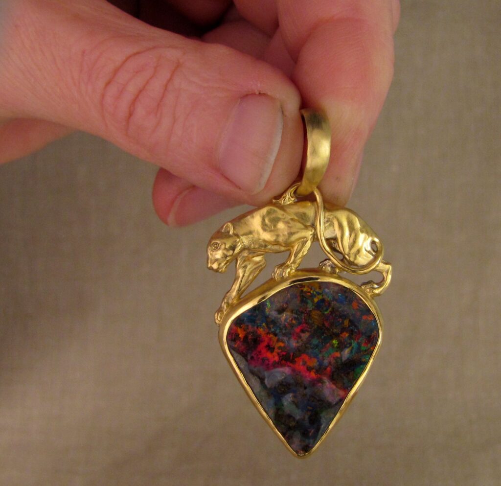 Custom carved Lioness Pendant in 22K, Rainbow Boulder Opal. Cheyenne Weil