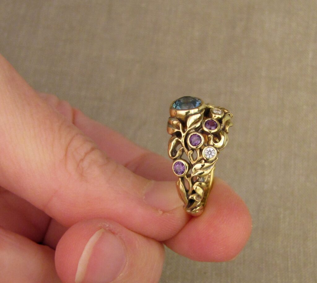 Custom designed & hand carved Blueberry Ring with Sapphire, Diamonds, and color-change garnets, 18K. Cheyenne Weil