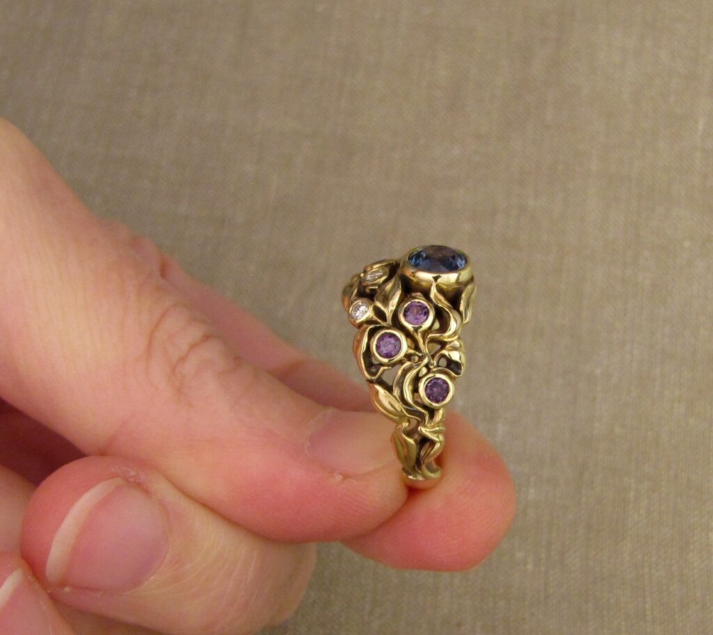 Custom designed & hand carved Blueberry Ring with Sapphire, Diamonds, and color-change garnets, 18K. Cheyenne Weil