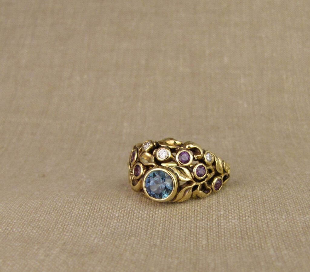 Custom designed & hand carved Blueberry Ring with Sapphire, Diamonds, and color-change garnets, 18K. Cheyenne Weil
