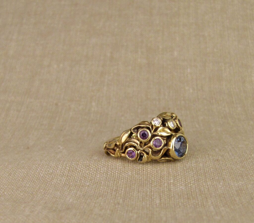 Custom designed & hand carved Blueberry Ring with Sapphire, Diamonds, and color-change garnets, 18K. Cheyenne Weil