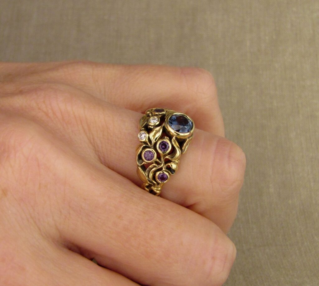 Custom designed & hand carved Blueberry Ring with Sapphire, Diamonds, and color-change garnets, 18K. Cheyenne Weil