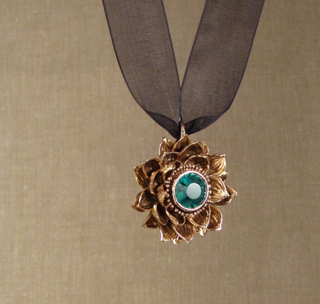 Custom designed & hand carved Lotus Pendant in 19K rose gold with emerald center. cheyenne weil