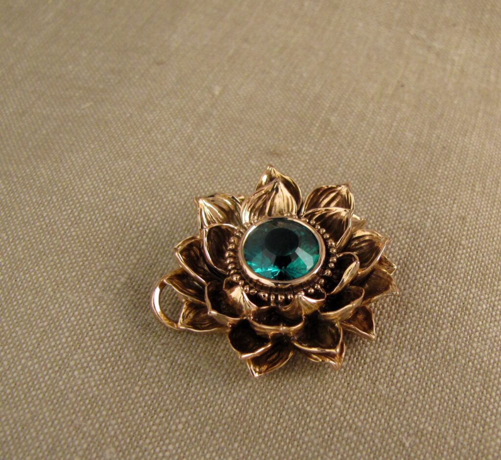 Custom designed & hand carved Lotus Pendant in 19K rose gold with emerald center. cheyenne weil