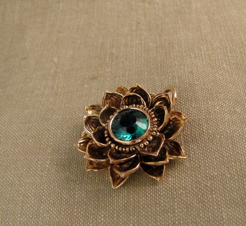 Custom designed & hand carved Lotus Pendant in 19K rose gold with emerald center. cheyenne weil