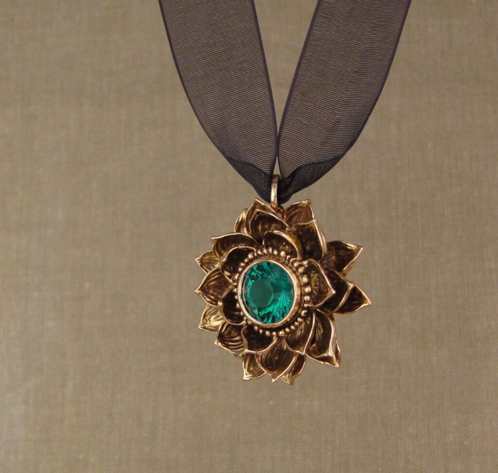Custom designed & hand carved Lotus Pendant in 19K rose gold with emerald center. cheyenne weil
