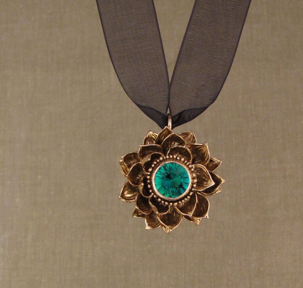 Custom designed & hand carved Lotus Pendant in 19K rose gold with emerald center. cheyenne weil