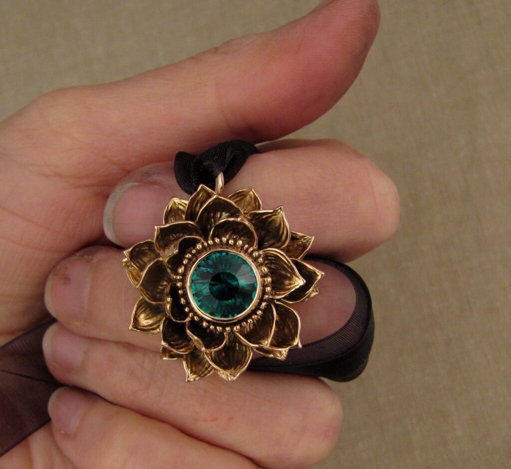 Custom designed & hand carved Lotus Pendant in 19K rose gold with emerald center. cheyenne weil