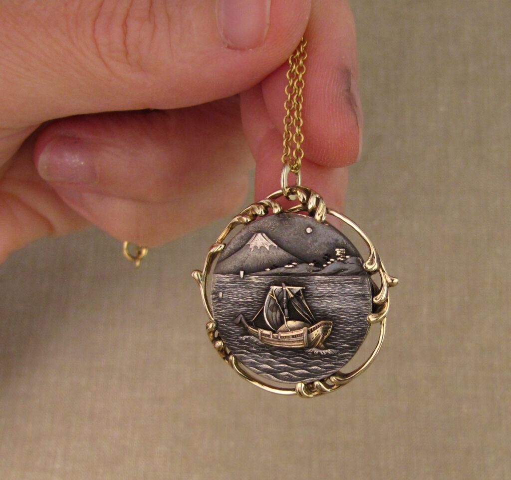 Custom designed & hand-carved pendant mounting for antique Japanese shakudo medallion. 14K. Cheyenne Weil 