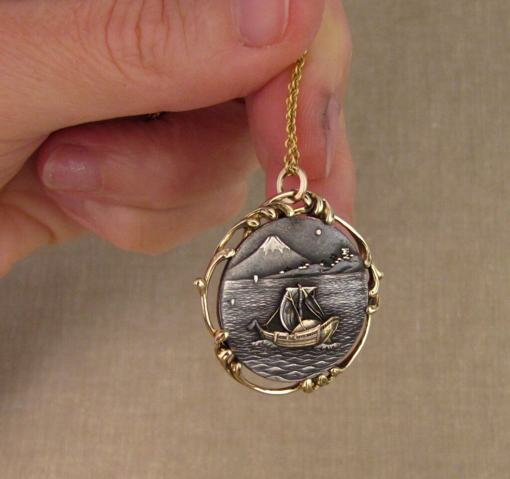 Custom designed & hand-carved pendant mounting for antique Japanese shakudo medallion. 14K. Cheyenne Weil 