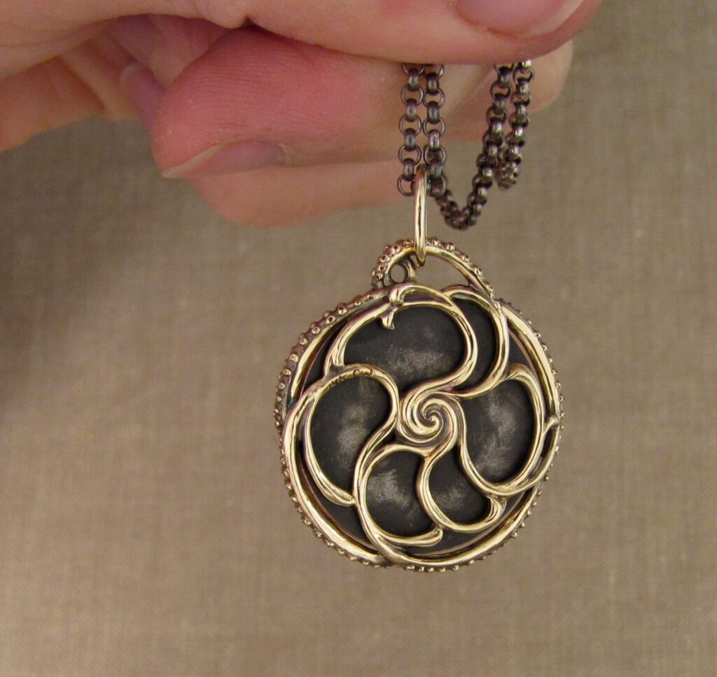 Custom designed & hand-carved tentacled Japanese Shakudo pendant in 14K. Cheyenne Weil