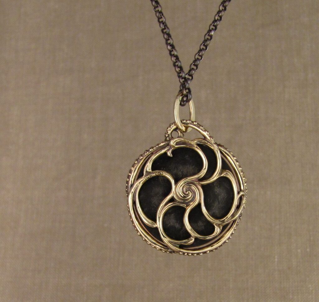 Custom designed & hand-carved tentacled Japanese Shakudo pendant in 14K. Cheyenne Weil